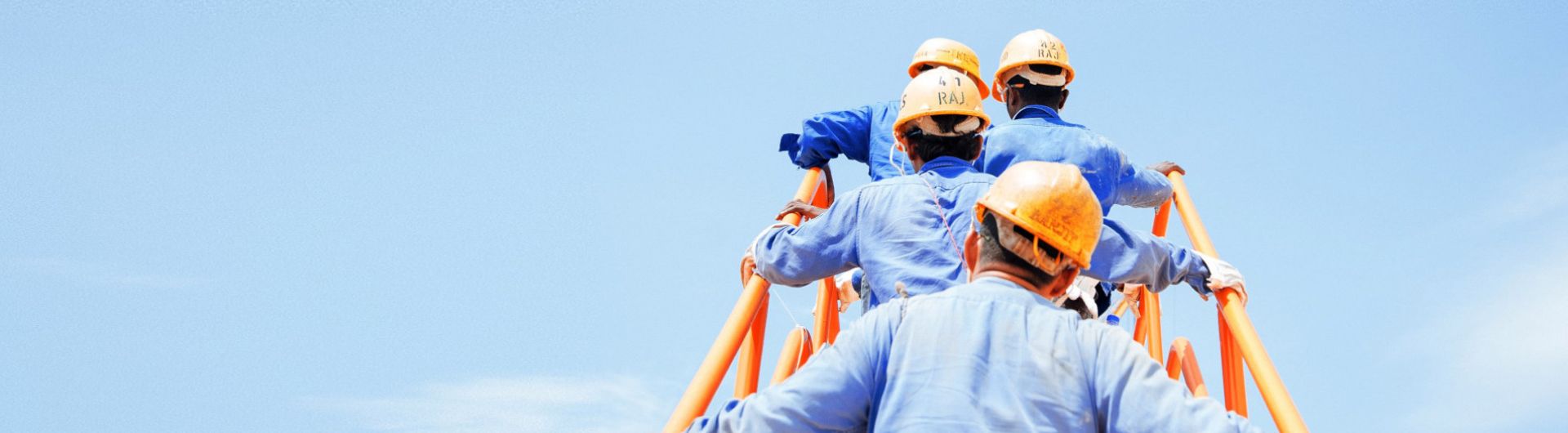workers climbing a ladder